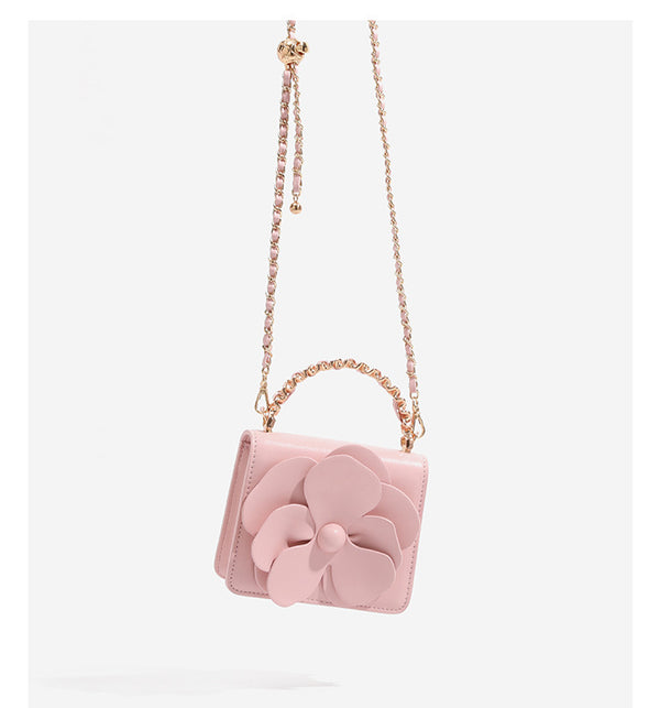 Small structured rectangular crossbody bag with layered 3D flower appliqué and gold-tone chain strap, detail view 16