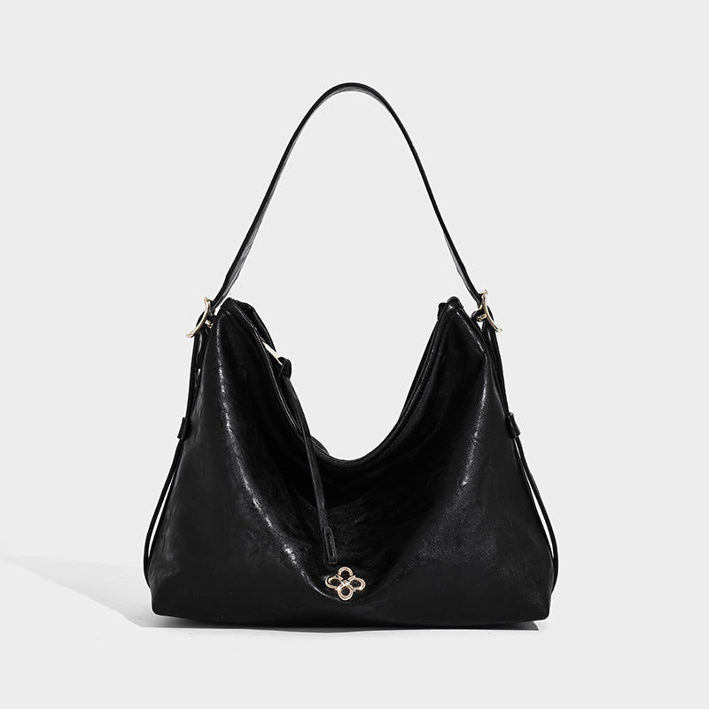 Slouchy leather-look hobo shoulder bag with gold-tone hardware and adjustable strap in brown, detail view 8