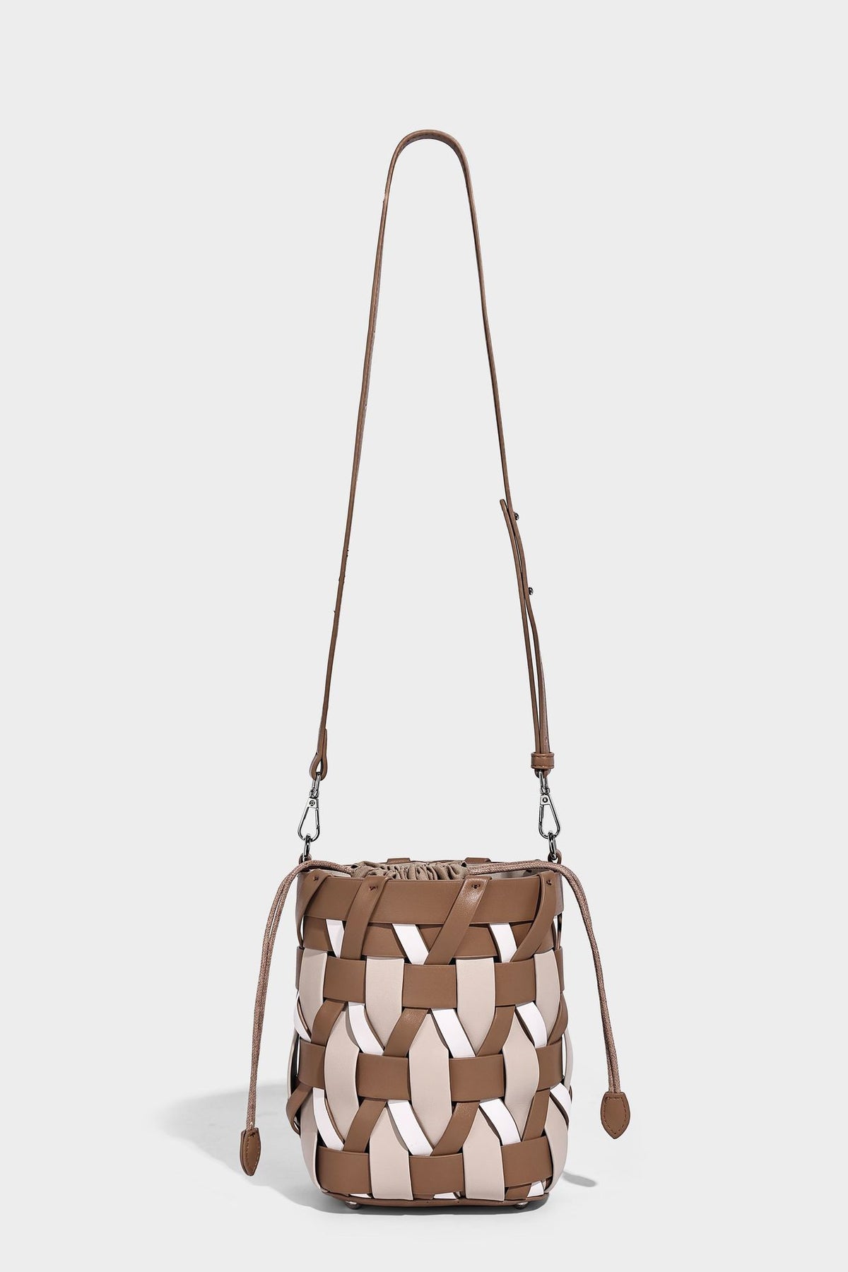 Small woven lattice bucket bag in tan and cream leather-look strips with drawstring top and detachable crossbody strap