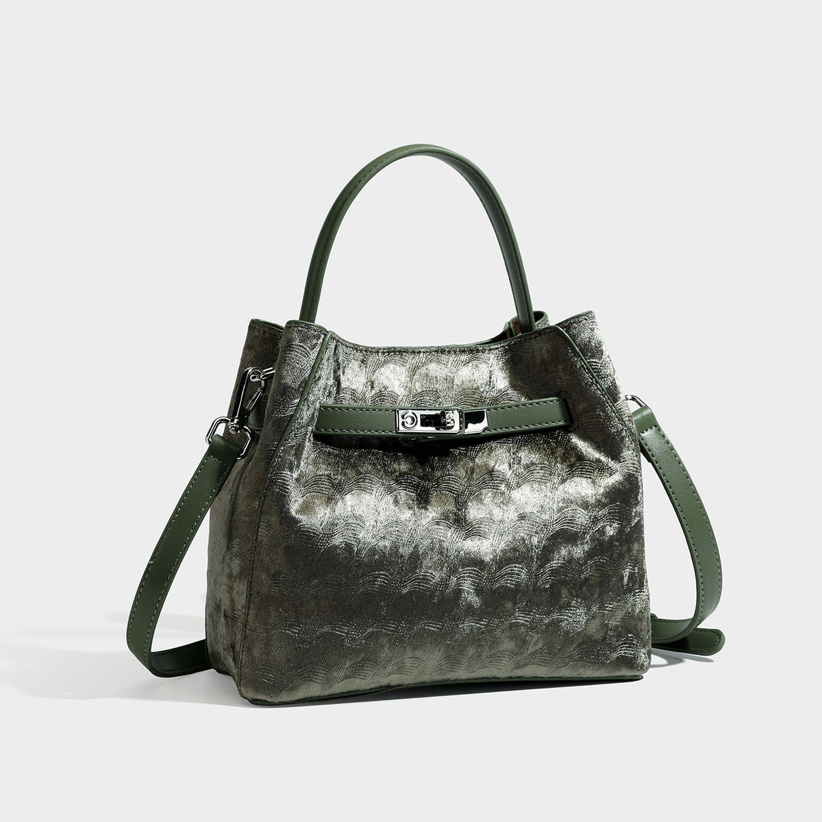 Small structured bucket satchel in embossed velvet-texture fabric with silver turn-lock hardware, rounded top handle, and