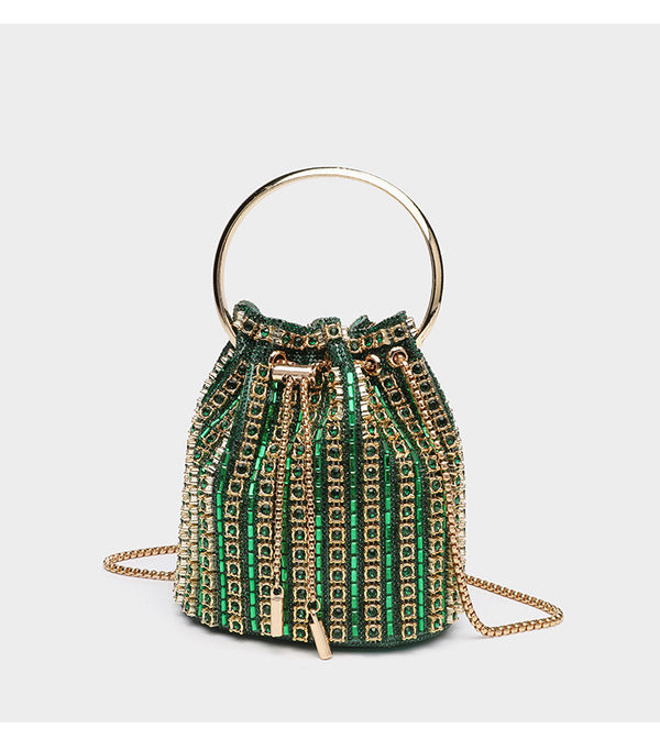Mini crystal rhinestone bucket bag with circular ring top handle, drawstring closure, and silver chain shoulder strap, detail