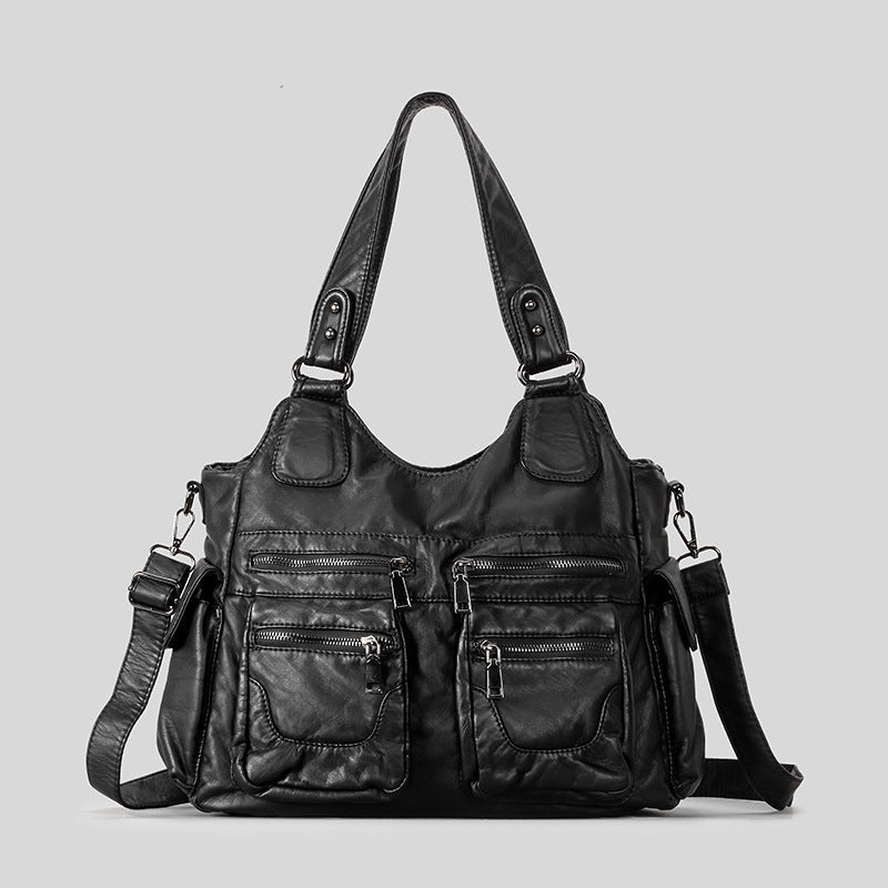 Large black distressed leather-look hobo shoulder bag with multi-zip front pockets, dual top handles, and removable