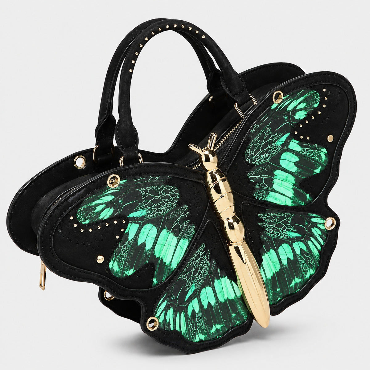 Schwarze Handtasche in Schmetterlingsform mit rosafarbenem Print auf den Flügelpartien und goldfarbenem, skulpturalem Reißverschlussanhänger in Form eines Schmetterlingskörpers, Detailansicht 4