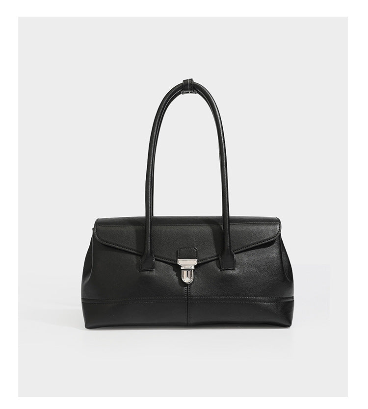 Structured rectangular satchel bag with dual rounded top handles and central metal turn-lock flap closure, detail view 13