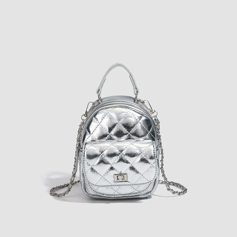 Quilted leather-look backpack purse with chain strap and turn-lock front pocket, detail view 6