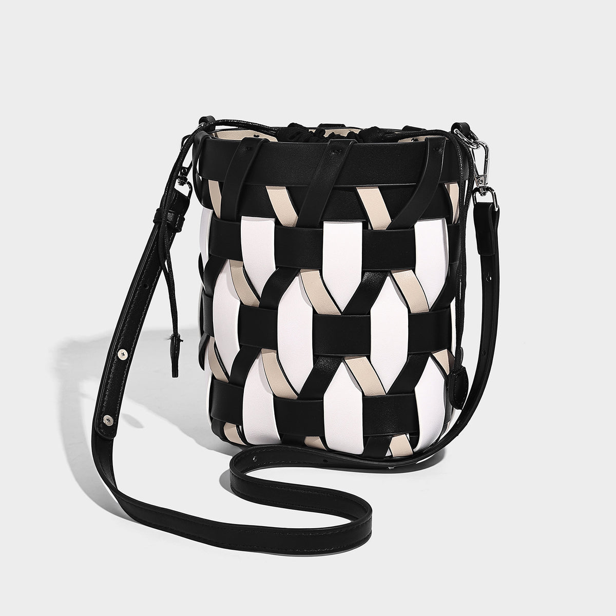 Small woven lattice bucket bag in tan and cream leather-look strips with drawstring top and detachable crossbody strap
