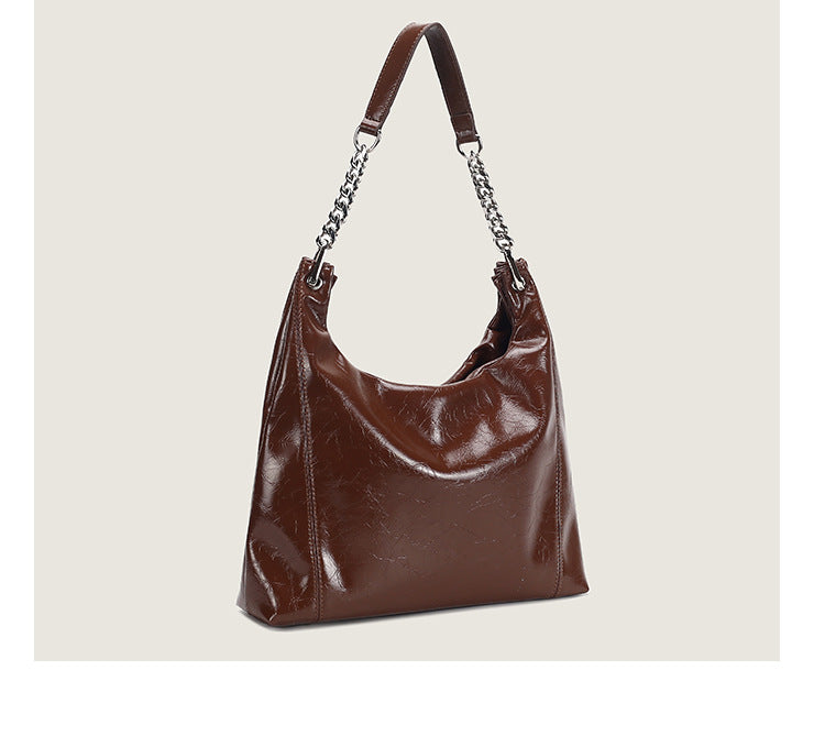 Glossy crinkled leather-look slouchy hobo bag with silver chain-and-leather shoulder strap and open top, detail view 14