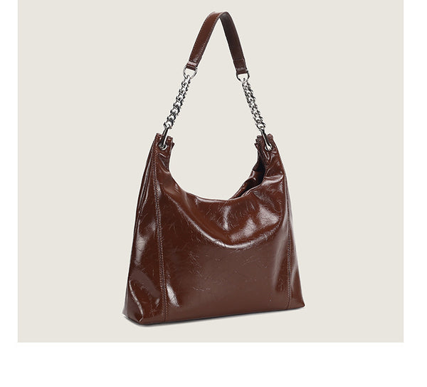 Glossy crinkled leather-look slouchy hobo bag with silver chain-and-leather shoulder strap and open top, detail view 14