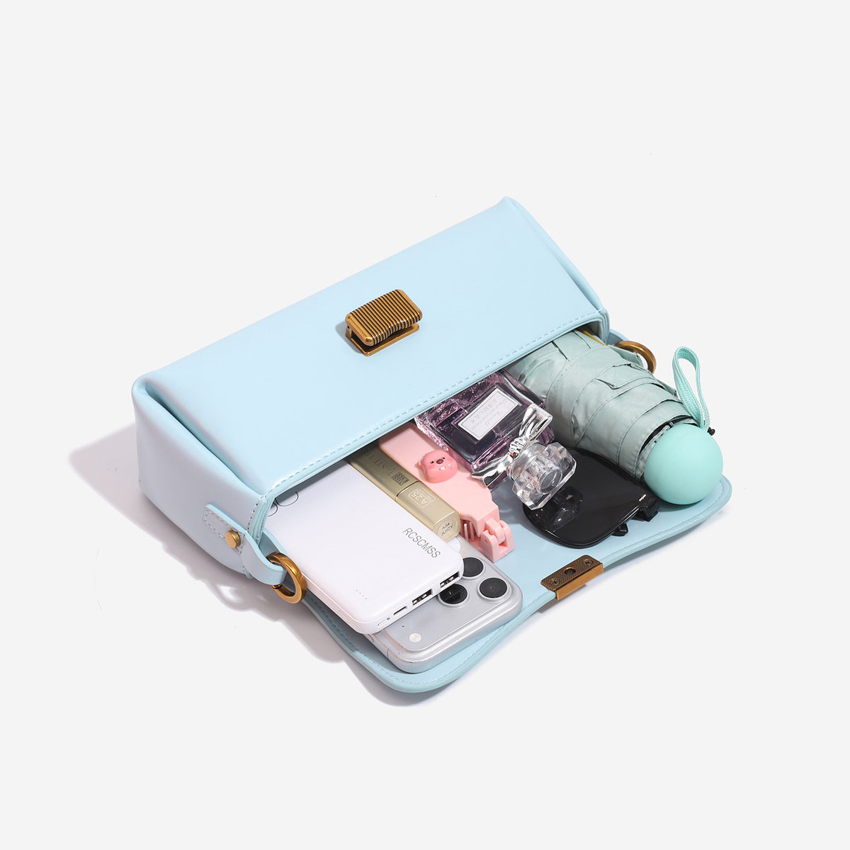 Structured rectangular baguette shoulder bag in pastel sky blue with smooth leather-look finish, ribbed gold-tone turn-lock