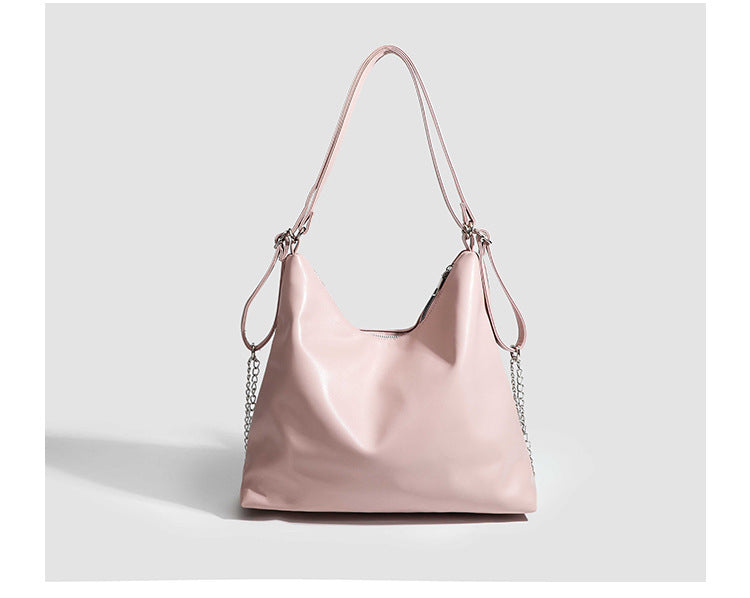 Glossy leather-look hobo shoulder bag with front bow lacing detail and silver-tone chain strap, detail view 21