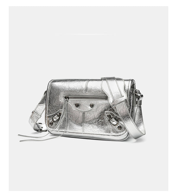 Small structured rectangular crossbody bag with crinkle leather-look finish, front zip pocket, gunmetal stud hardware, and