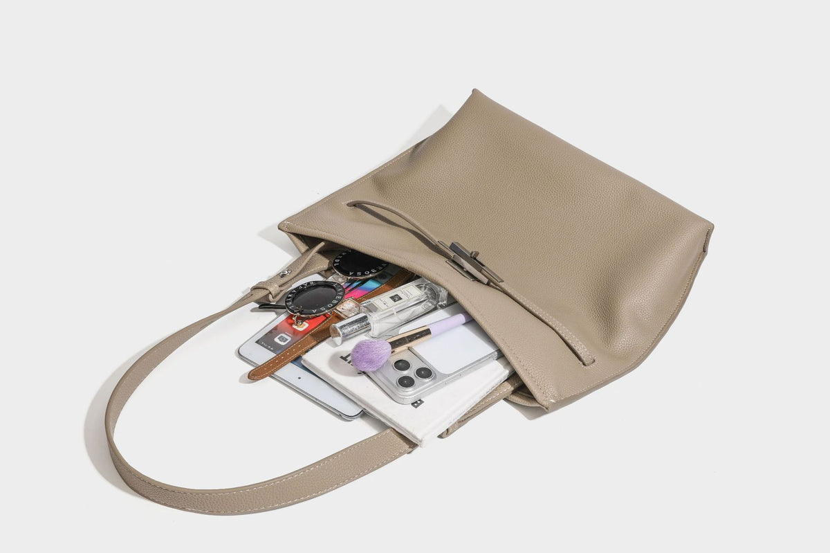Pebbled leather-look tote bag with front toggle hardware and long shoulder strap, detail view 32