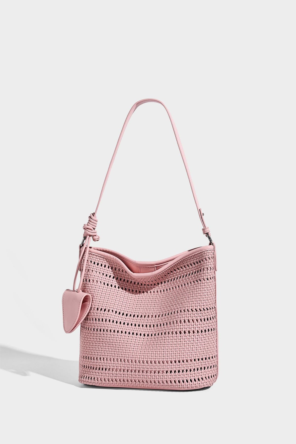 Handwoven open-weave shoulder bag with leather-look trim, knotted adjustable strap, and clip-on sunglasses sleeve pouch