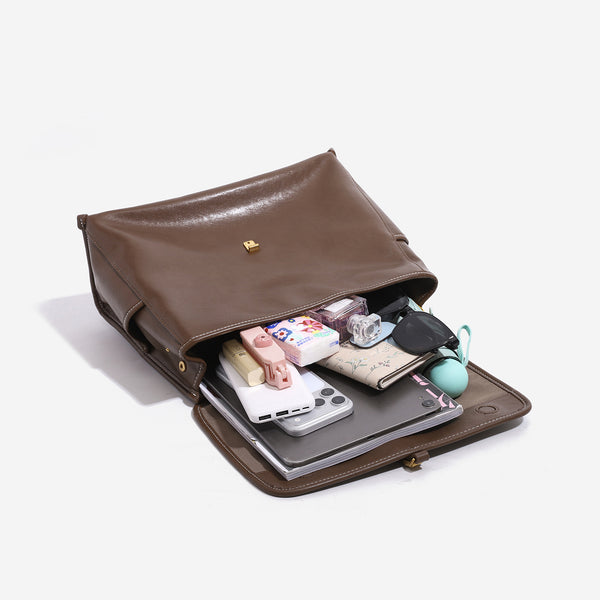 Structured retro flap backpack handbag in brown leather-look finish with gold-tone toggle clasp and top handle, detail view 4