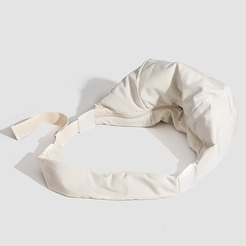 Large crescent sling shoulder bag in gathered fabric with zip closure and adjustable strap, detail view 4