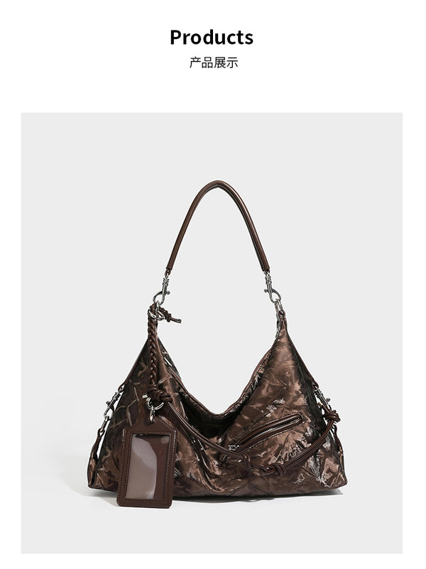 Slouchy hobo shoulder bag in crinkled metallic brown leather-look finish with braided rope knots, silver-tone hardware