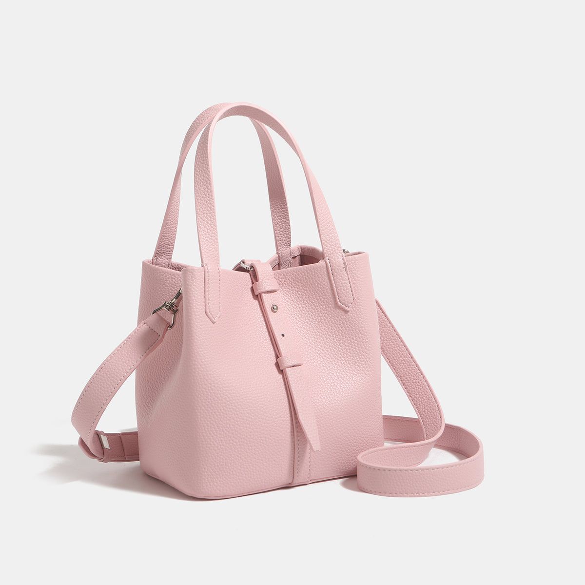 Small structured pebbled leather-look bucket tote bag with dual top handles and silver-tone hardware, detail view 3
