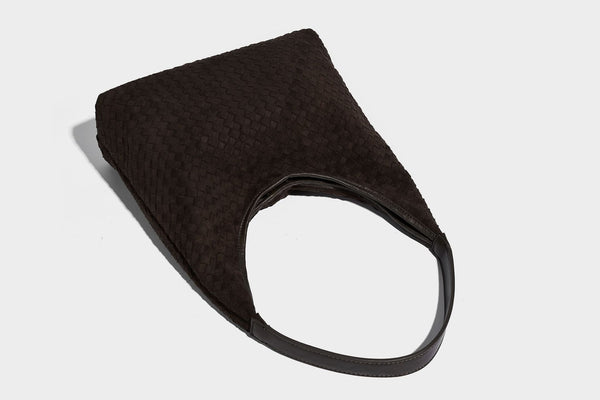 Large slouchy woven hobo tote bag with curved shoulder strap and triangular silhouette, detail view 16