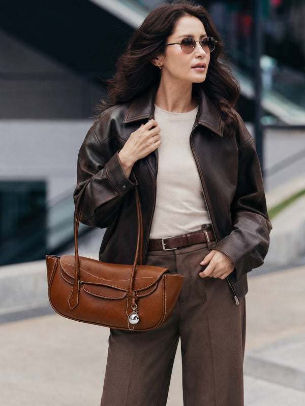 Structured leather-look flap shoulder bag with contrast stitching and silver ball charm hardware, detail view 14