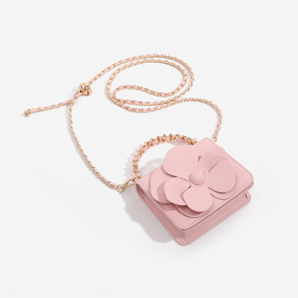 Small structured rectangular crossbody bag with layered 3D flower appliqué and gold-tone chain strap, detail view 4