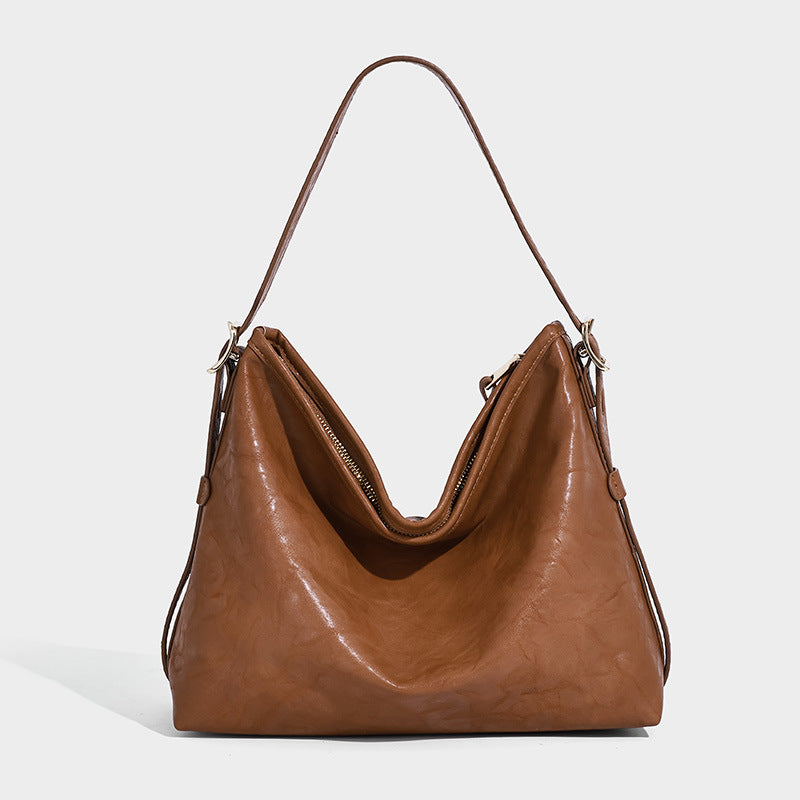 Slouchy leather-look hobo shoulder bag with gold-tone hardware and adjustable strap in brown, detail view 22