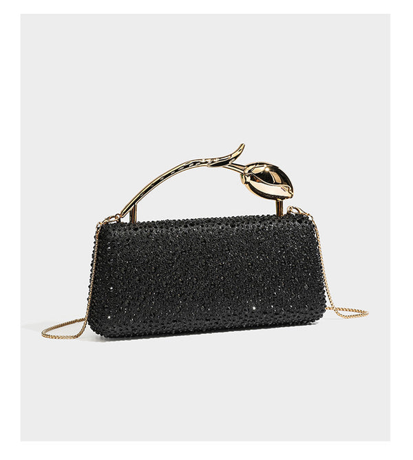 rectangular hard-case rhinestone evening clutch with sculptural gold-tone branch-and-bud top handle and detachable chain