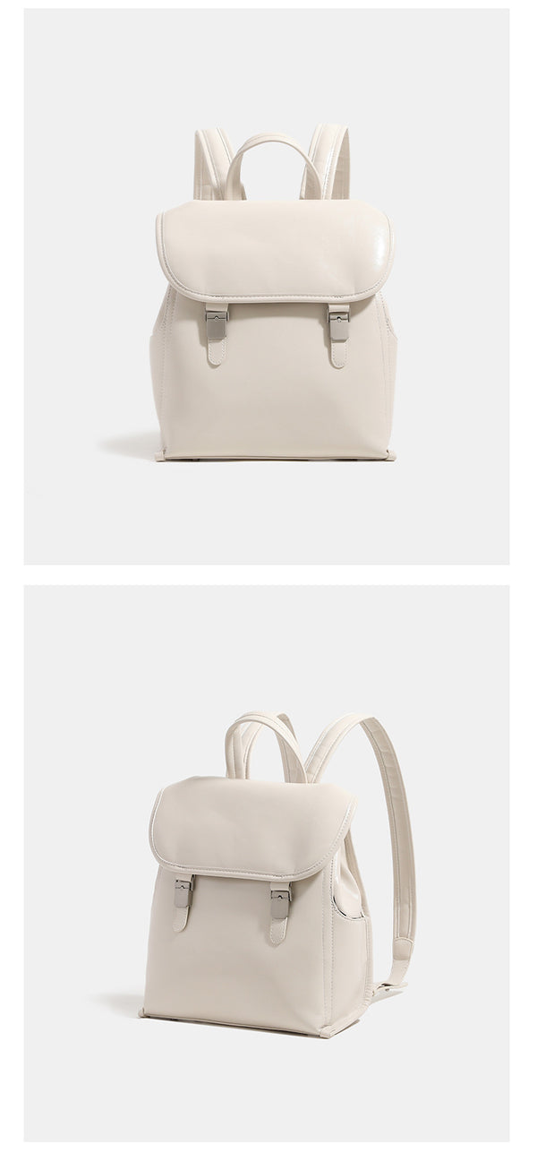 Structured glossy leather-look flap backpack with twin buckle closures and top grab handle, detail view 11