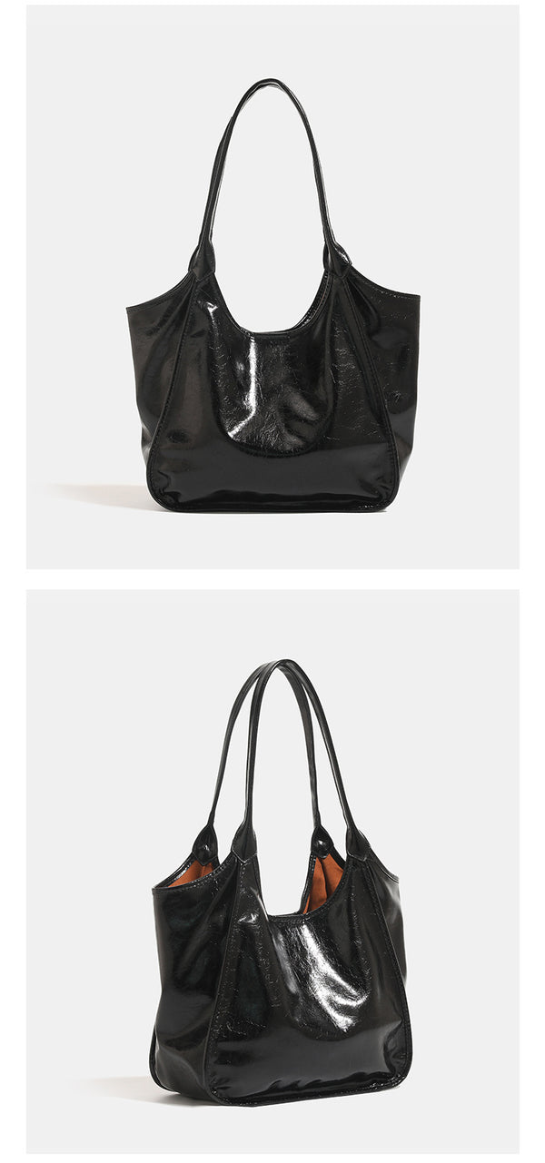 Large open-top shoulder tote bag with glossy crinkled metallic finish and long double straps, detail view 9