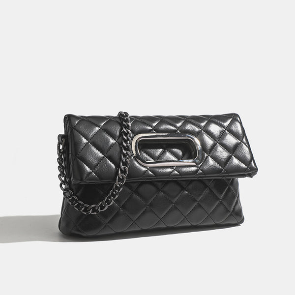 Quilted diamond-stitch flap crossbody bag with gunmetal chain strap and cut-out bar handle, detail view 2