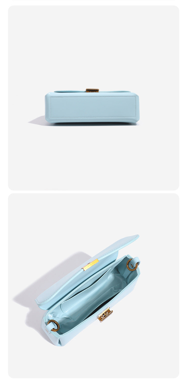 Structured rectangular baguette shoulder bag in pastel sky blue with smooth leather-look finish, ribbed gold-tone turn-lock