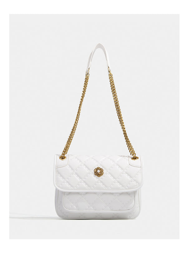 Compact diamond-quilted flap shoulder bag with gold-tone chain strap and floral turn-lock clasp, detail view 11