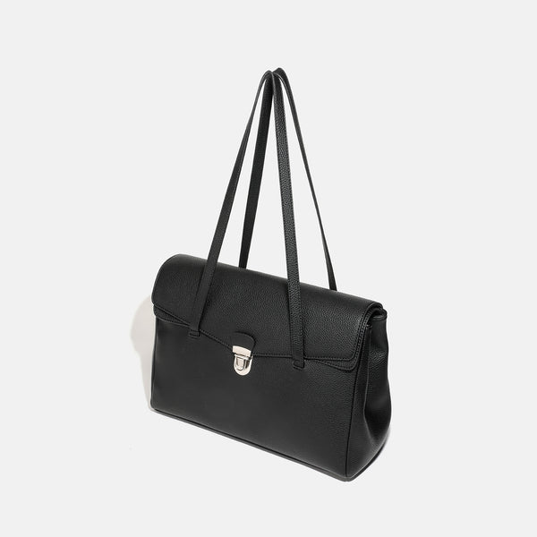 Structured black pebbled-finish flap tote bag with silver turn-lock clasp and long double shoulder straps, detail view 3