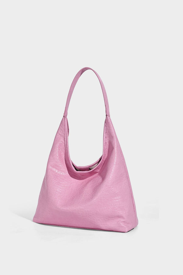 Slouchy hobo shoulder bag in pale yellow glossy pebbled leather-look finish with single shoulder strap and detachable front