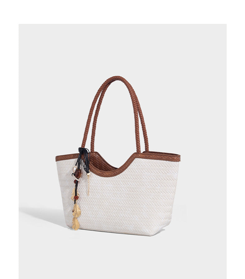 Large open-top woven tote bag with contrasting braided double handles and matching drawstring pouch, detail view 15