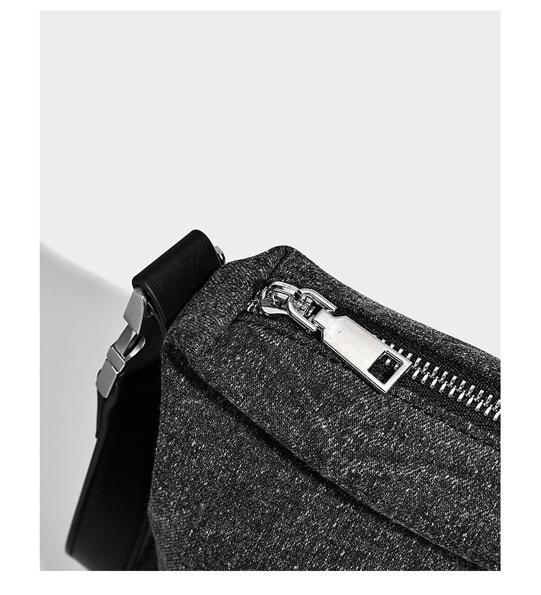 Charcoal denim-textured slouchy hobo bag with zip-top closure, silver-tone hardware, and adjustable leather-look crossbody
