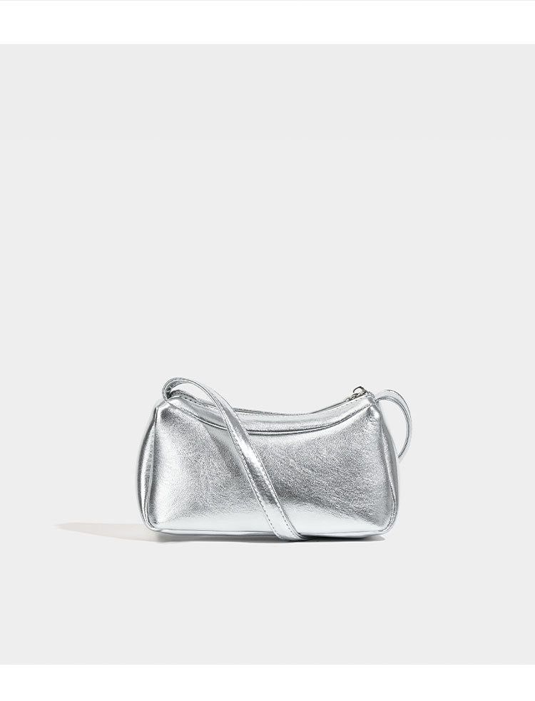 Compact curved silver metallic shoulder bag with top zip closure and slim single strap, detail view 7