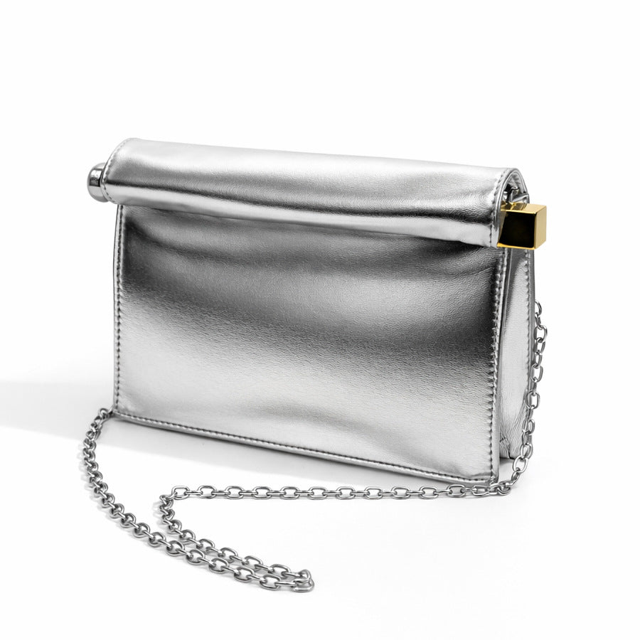 Structured rectangular clutch bag with rolled-top bar closure, gold-tone and silver-tone mixed metal hardware, detail view 9
