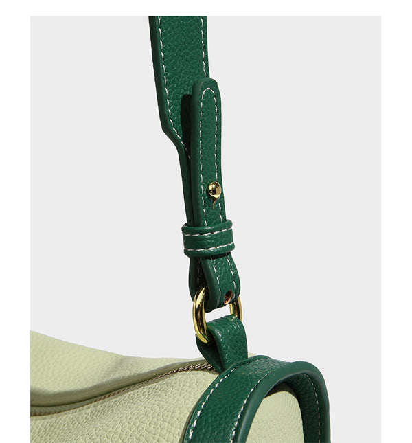 Structured two-tone shoulder bag with pebbled leather-look finish, contrast trim, top zip closure, and gold-tone hardware