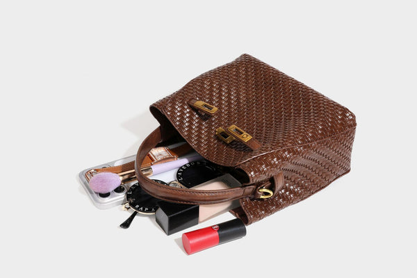 Structured woven leather-look bucket bag with gold-tone turn-lock hardware and detachable shoulder strap, detail view 43