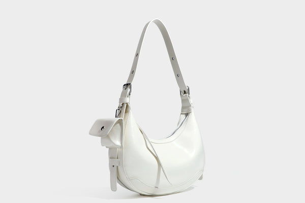 Glossy leather-look crescent hobo shoulder bag with dark contrast trim, silver-tone hardware, and attached mini flap pouch