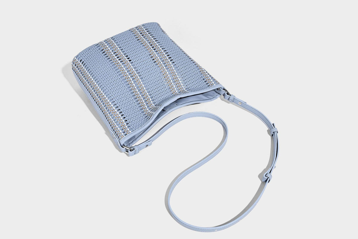 Woven bucket shoulder bag with leather-look trim, silver-tone hardware, and beaded tassel charm, detail view 39