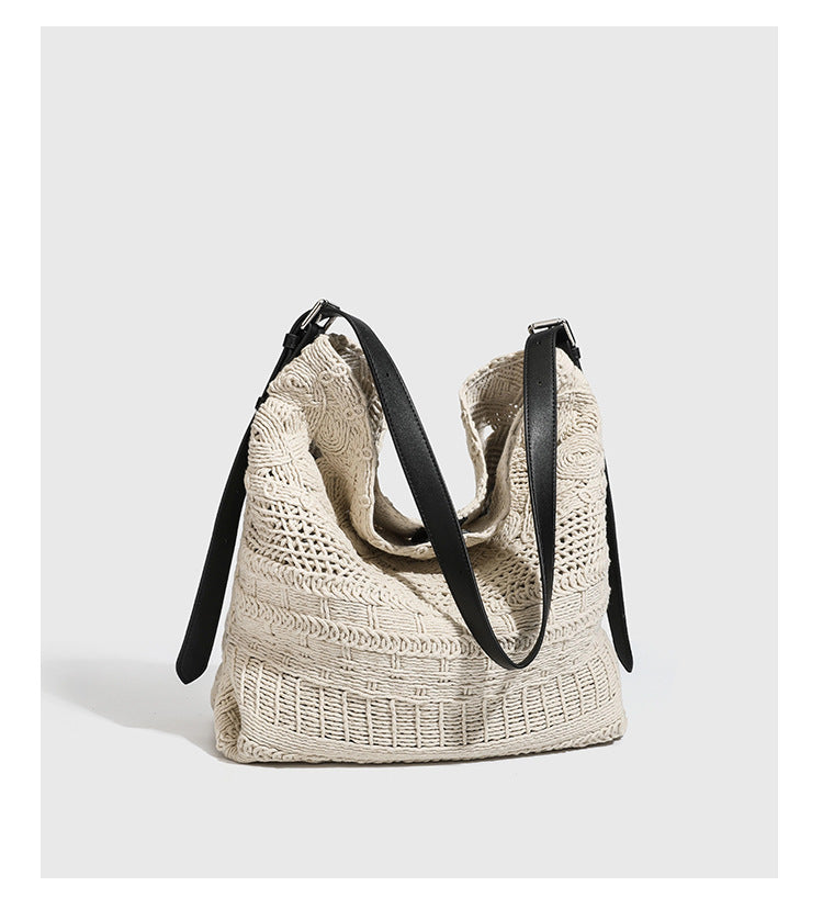Cream woven rope-cord hobo bag with black adjustable leather-look strap and matching cream drawstring pouch, detail view 10