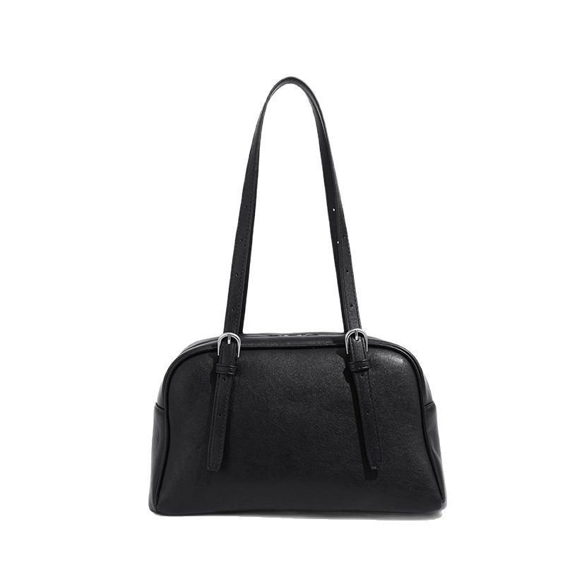Structured dome-shaped shoulder bag with leather-look finish, top zipper closure, dual adjustable slim straps, and, detail