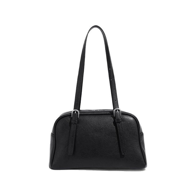 Structured dome-shaped shoulder bag with leather-look finish, top zipper closure, dual adjustable slim straps, and, detail