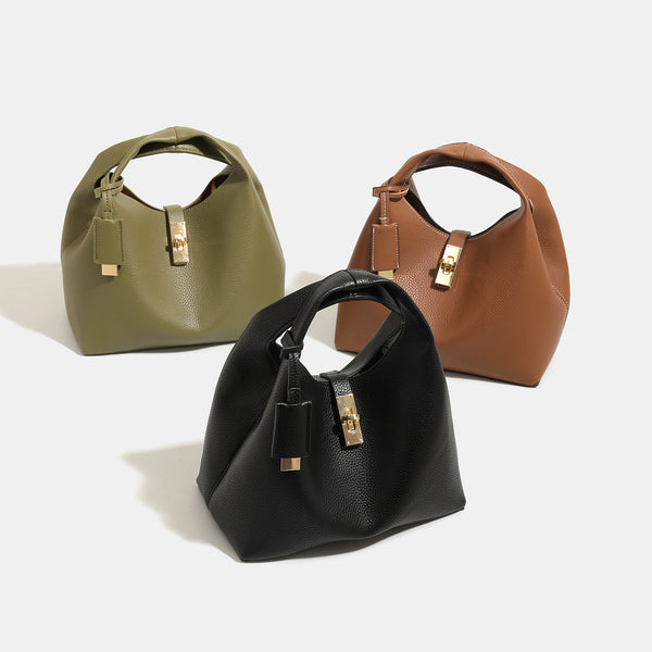 Structured pebbled leather-look bucket bag with gold-tone turn-lock clasp and looped top handle, detail view 2