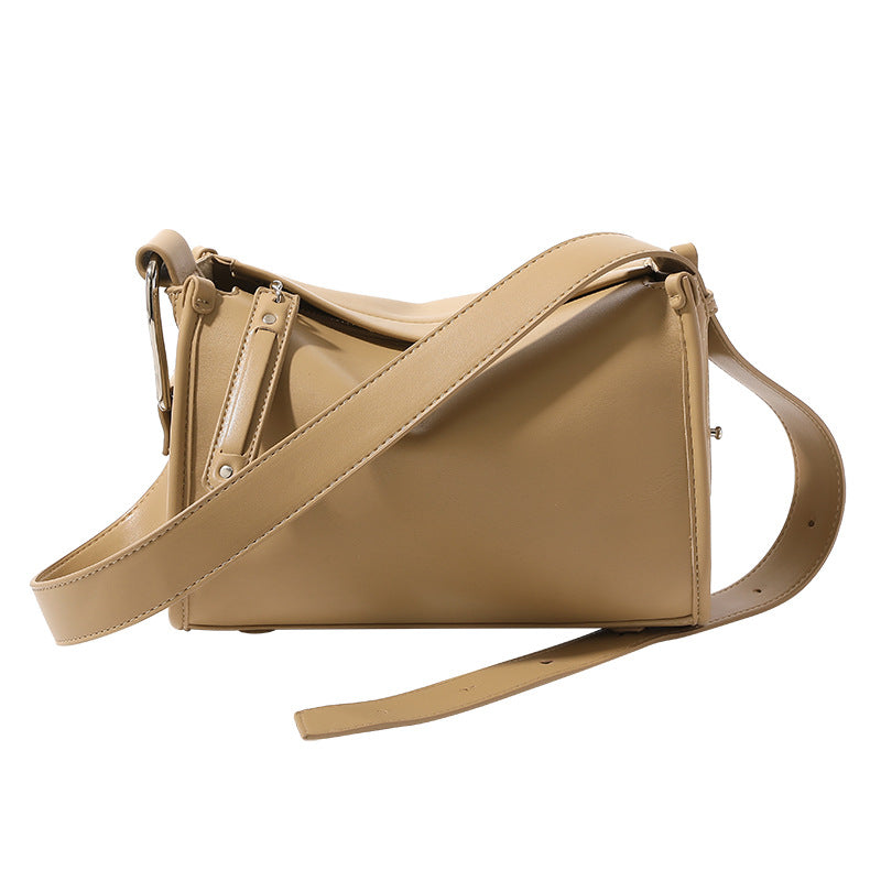 Structured smooth leather-look shoulder bag with top zip closure, tassel pull, and adjustable crossbody strap in khaki