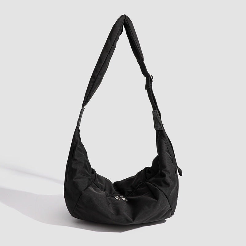 Large crescent sling shoulder bag in gathered fabric with zip closure and adjustable strap, detail view 6