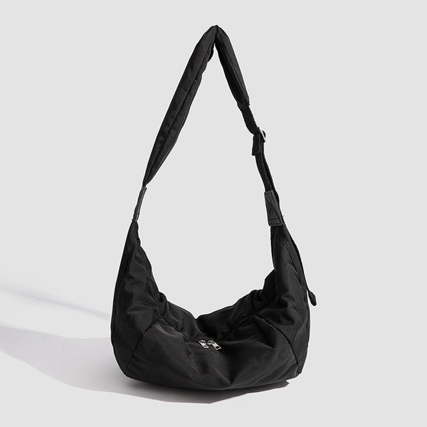 Large crescent sling shoulder bag in gathered fabric with zip closure and adjustable strap, detail view 6
