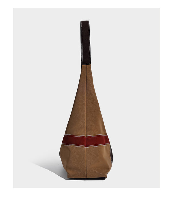 Multicolor patchwork hobo shoulder bag with brown tan olive mustard red and blue suede-look panels, contrast white stitching