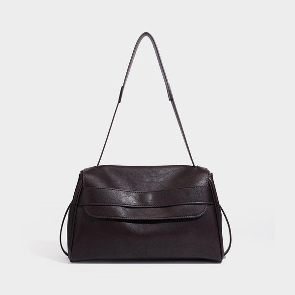 Structured rectangular flap shoulder bag in dark brown leather-look finish with long single strap and layered front panel